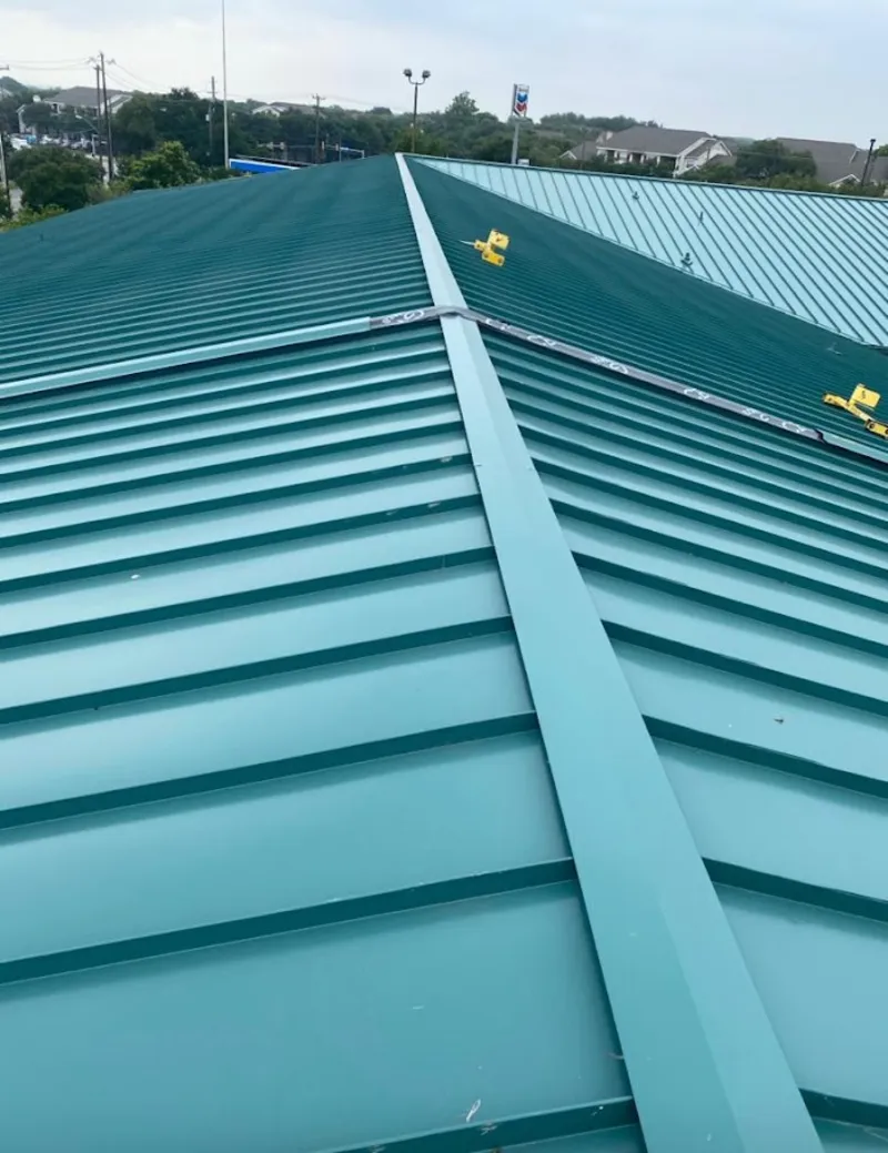 Green commercial metal roof ridge and valley for Metal Roof Repair in St. Cloud