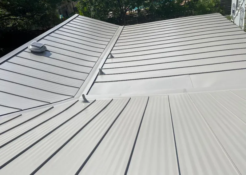 Solar attic fan installed on a metal roof for Roof Ventilation in St. Cloud